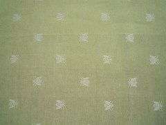 Tovagliolo, tessitura artigianale in misto lino/cotone, disegno con api di colore verde salvia, cm 40x40.